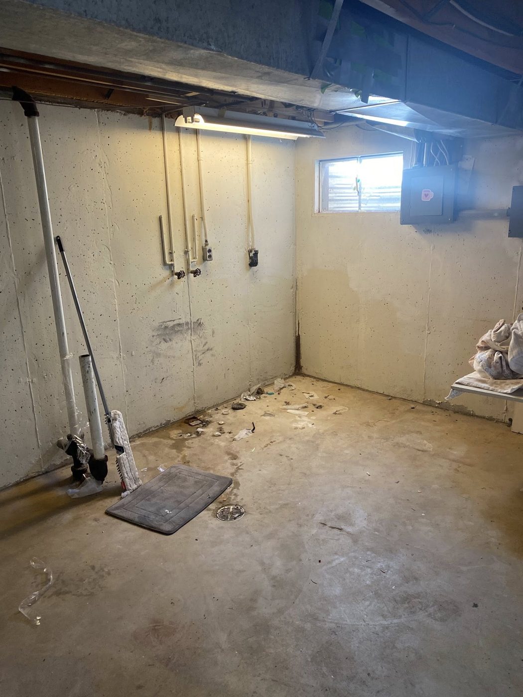 Cluttered basement before cleanout