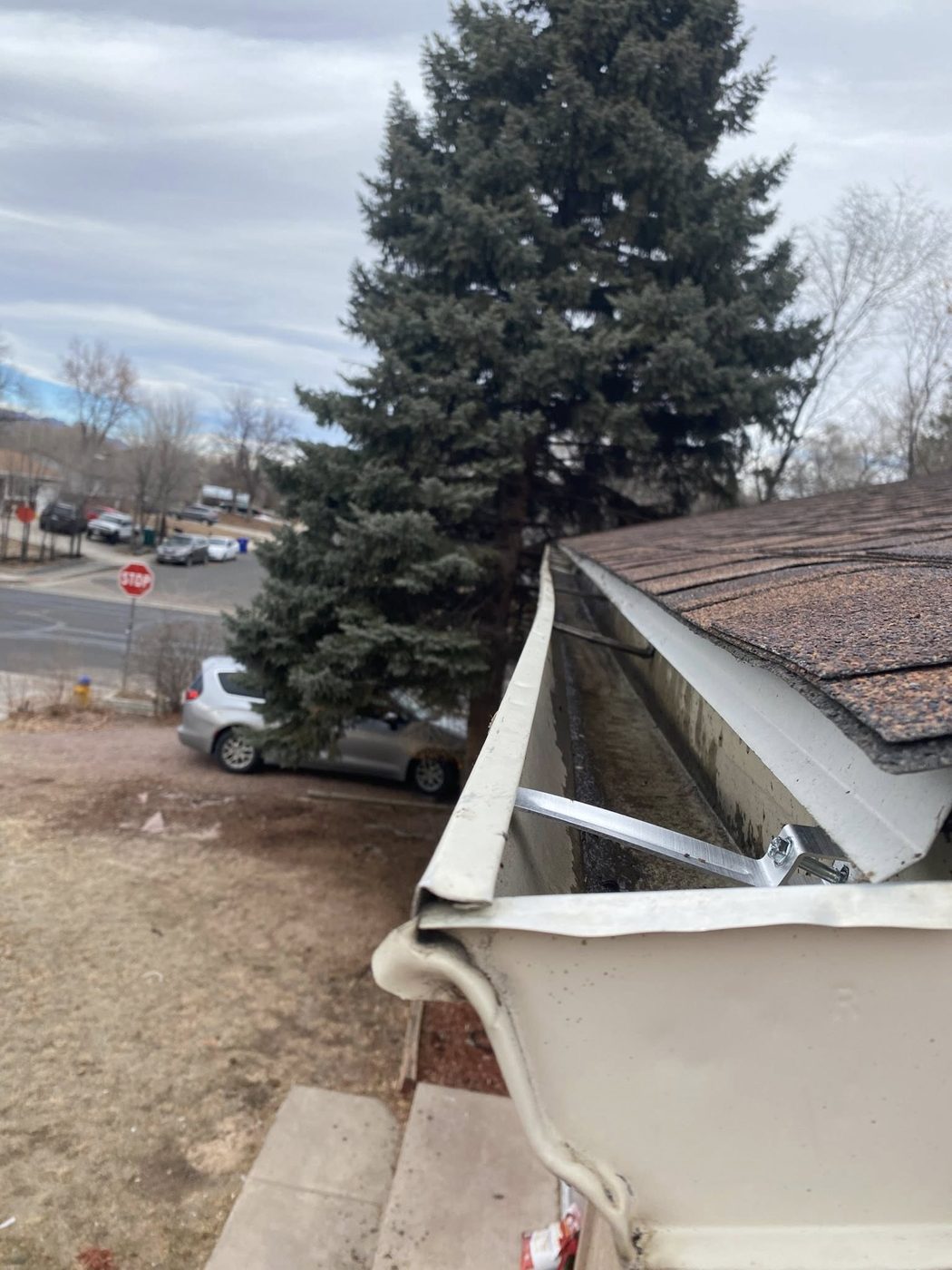 Damaged gutter before repair