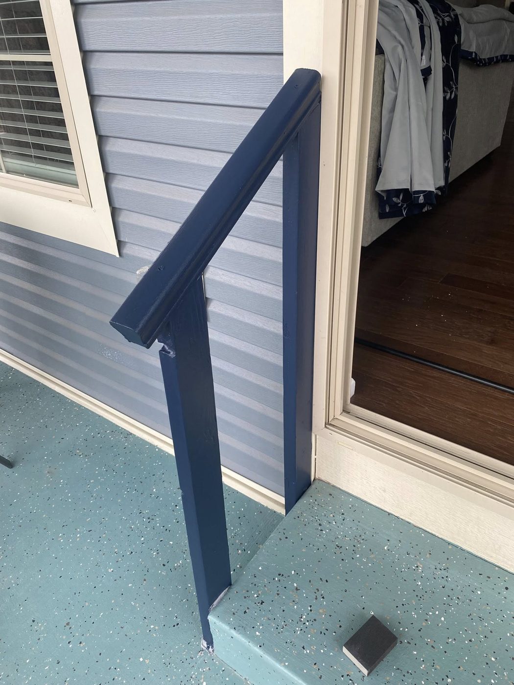 Freshly painted porch handrail