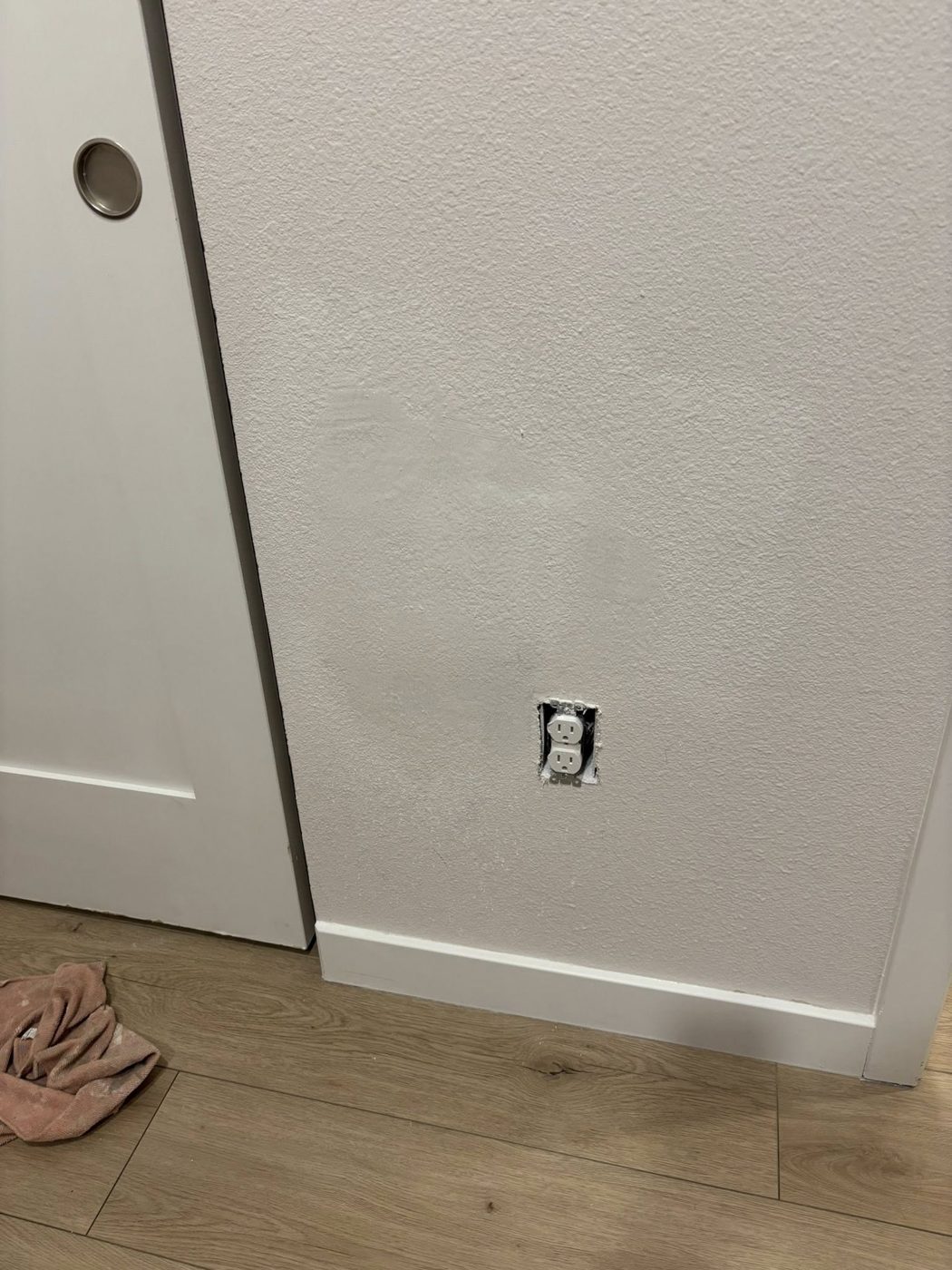 Patched wall around the outlet